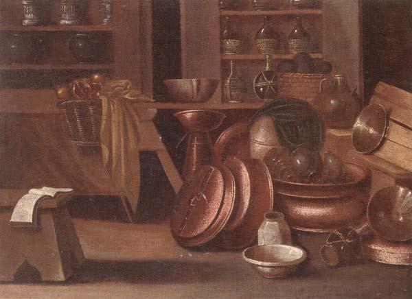 unknow artist A Kitchen still life of utensils and fruit in a basket,shelves with wine caskets beyond